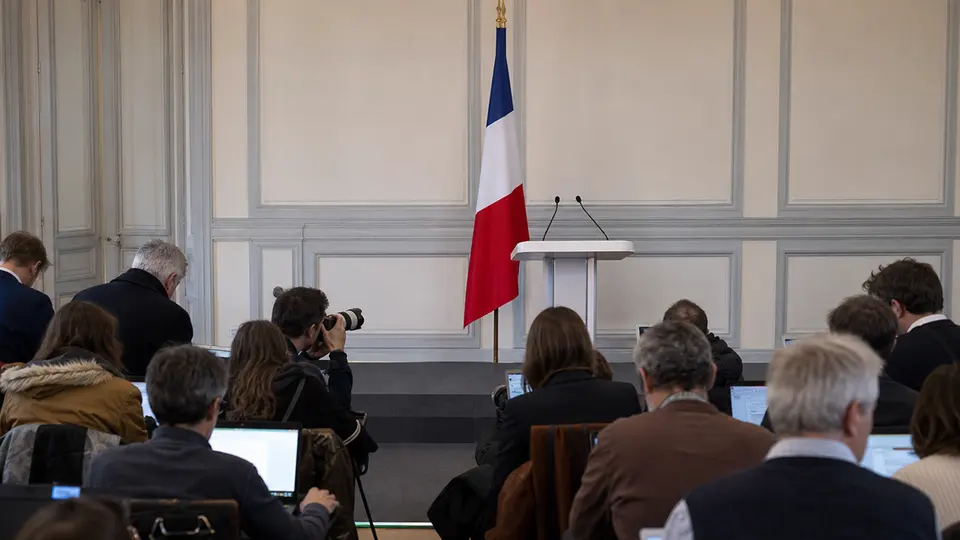Marine Le Pen at a campaign event during the 2027 French presidential election campaign, addressing a crowd of supporters